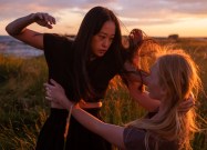 women fighting in a field